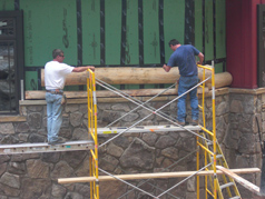 installing hand crafted log siding